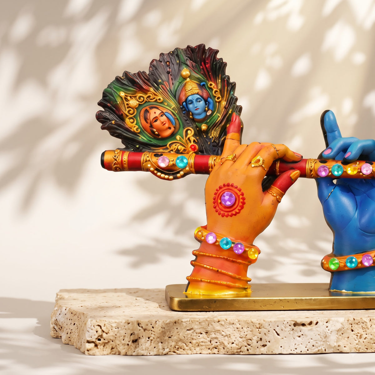 A divine idol of Radha-Krishna holding a flute