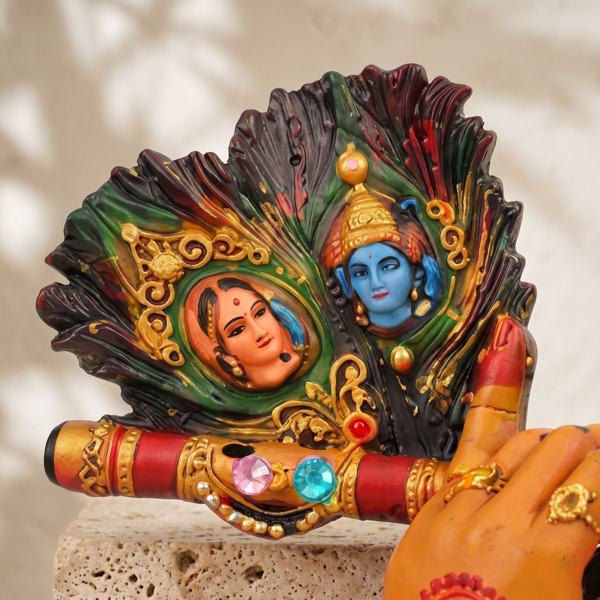 A divine idol of Radha-Krishna holding a flute