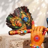 A divine idol of Radha-Krishna holding a flute