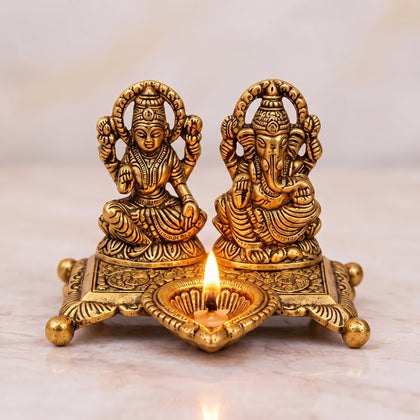 Golden Aluminium Lakshmi-Ganesha Idol with a Diya