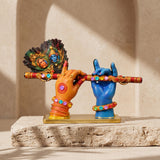 A divine idol of Radha-Krishna holding a flute