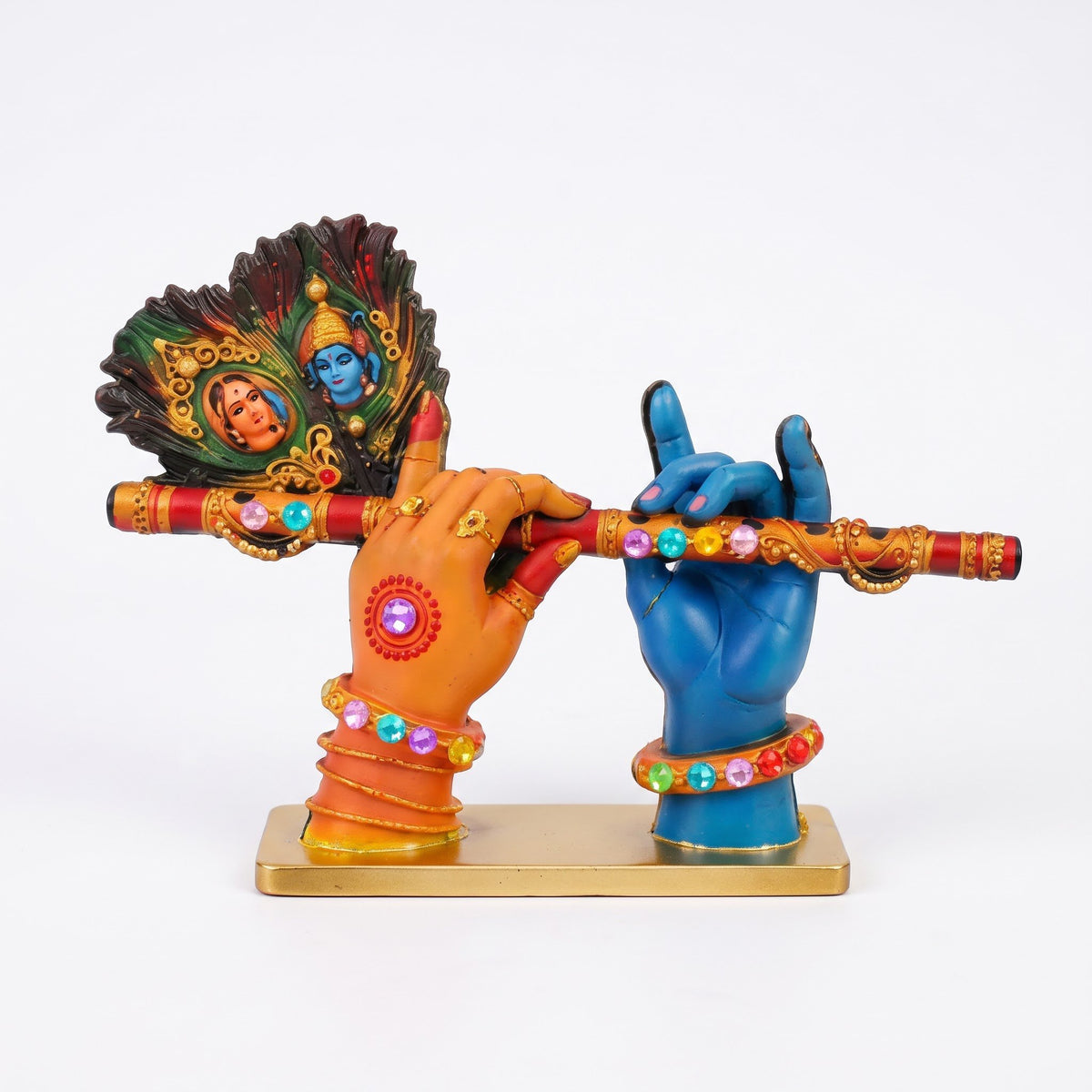 A divine idol of Radha-Krishna holding a flute