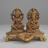 Golden Aluminium Lakshmi-Ganesha Idol with a Diya